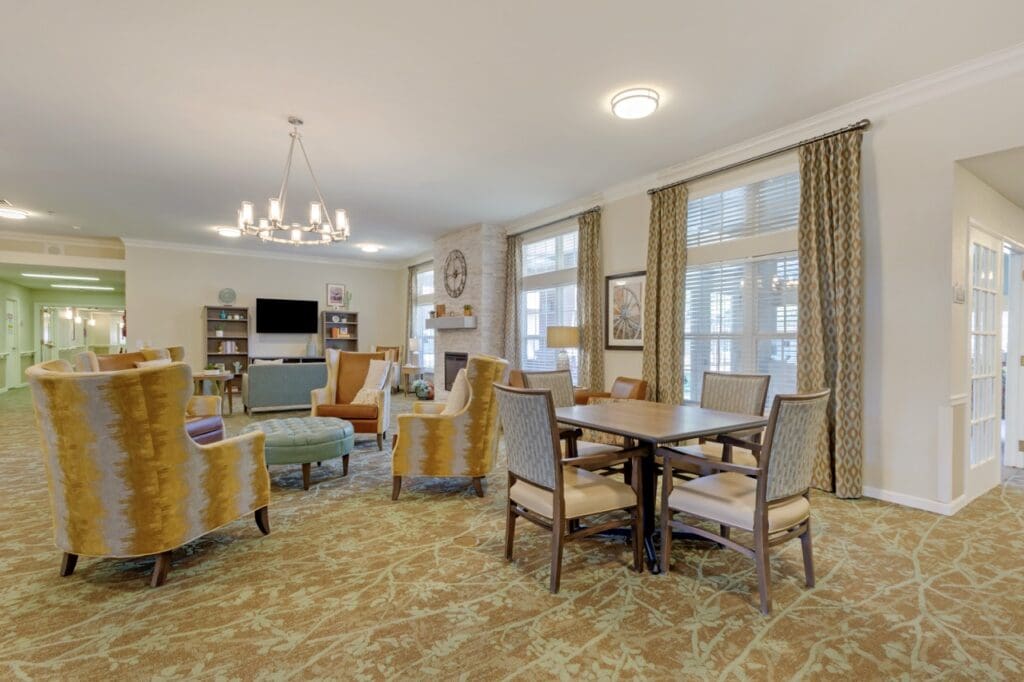 303A2087 Large - Inspirations of Peoria Living room area where residents do activities together at The Inspirations of Peoria.